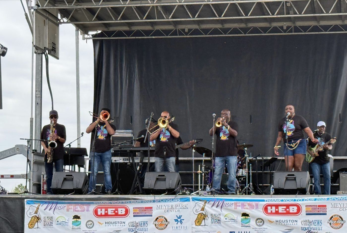 A brass band performing on the MusicFest stage
